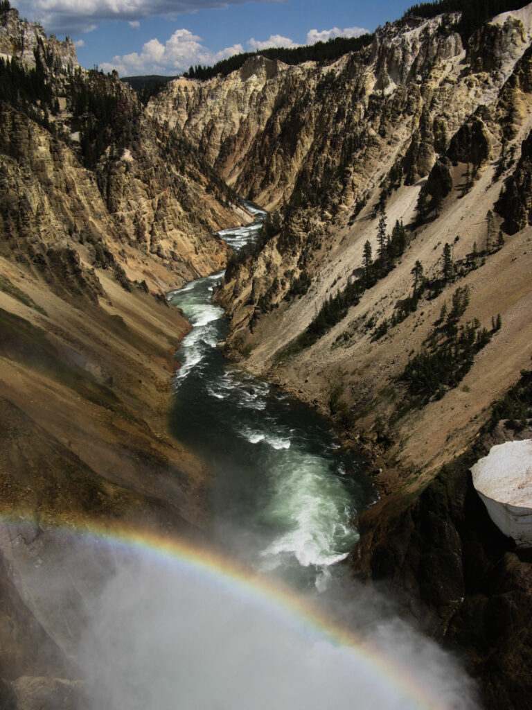 Yellowstone River in Grand Canyon of the Yellowstone, rainbow visible in foreground