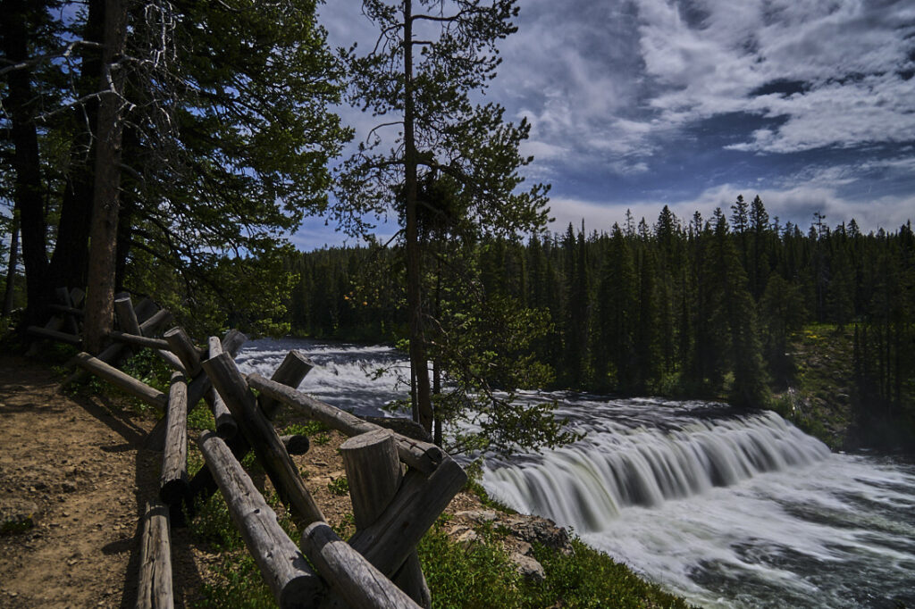 Trail and log fence overlooking Cave Falls, Yellowstone National Park