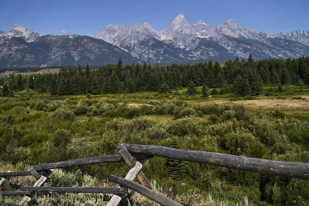 Grand Tetons, wood fence in foreground, Grand Teton National Park