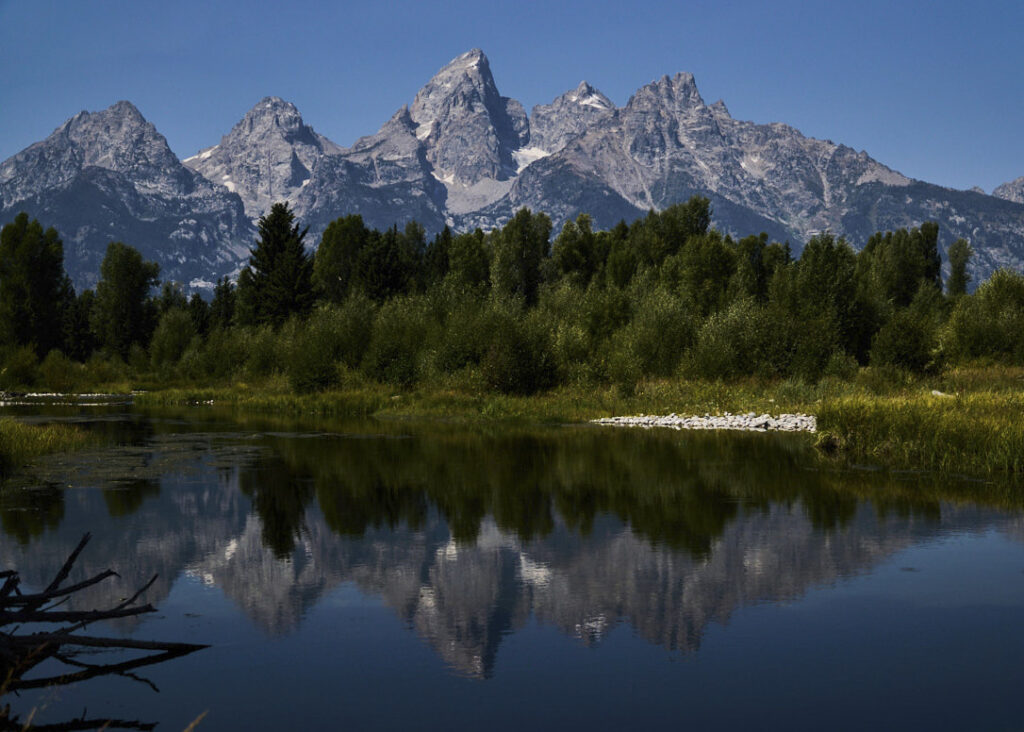Grand Tetons reflected in river as seen from Schwabacher Landing, Grand Teton National Park